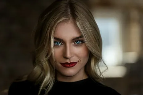 a woman with blonde hair and red lipstick